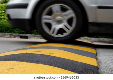 city-car-speed-limit-bump-260nw-2669465033